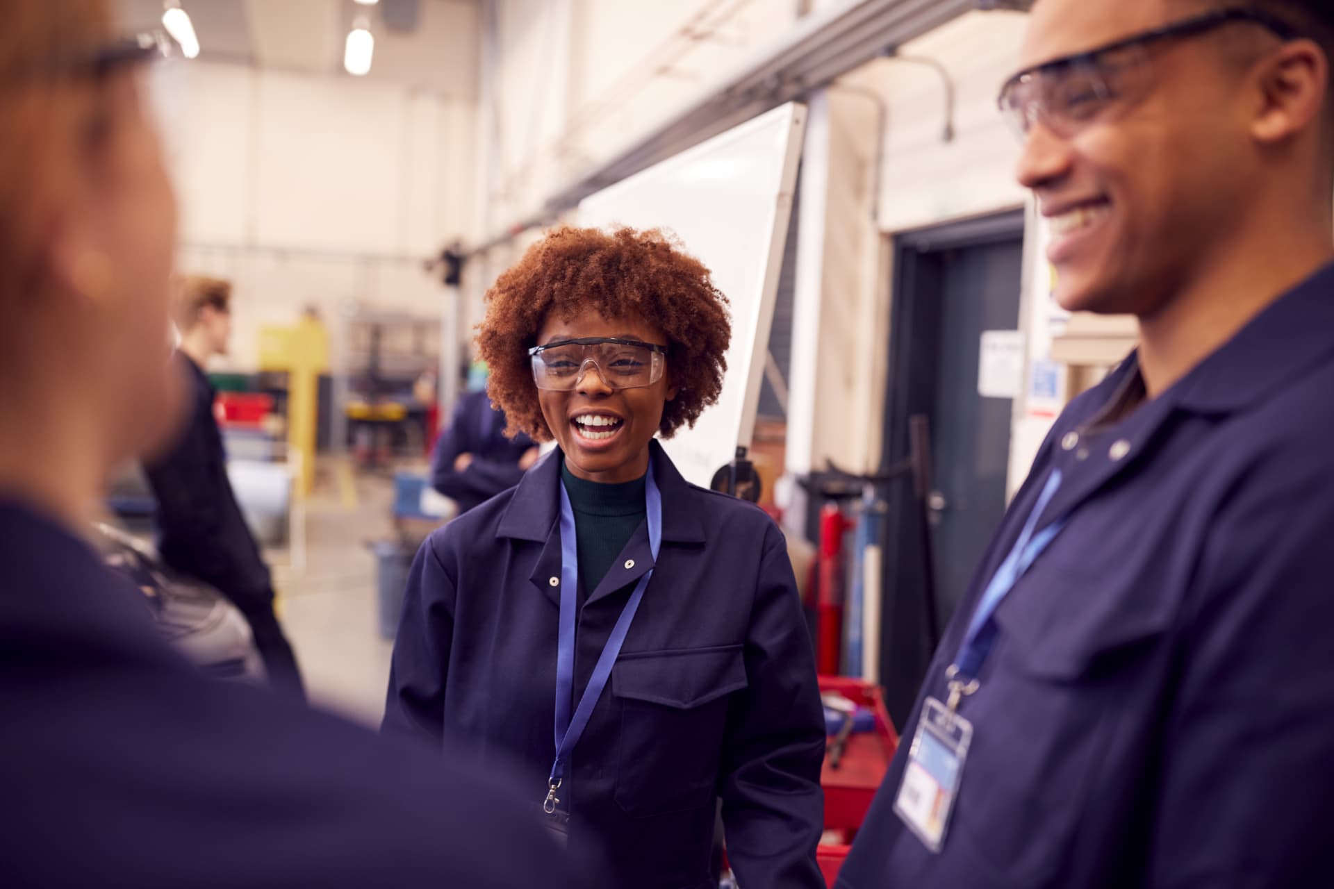 Manufacturing team members talking together on the plant floor Manufacturing team members talking together on the plant floor